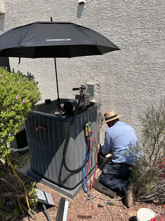 HVAC technician performing outdoor AC maintenance in Sangaree